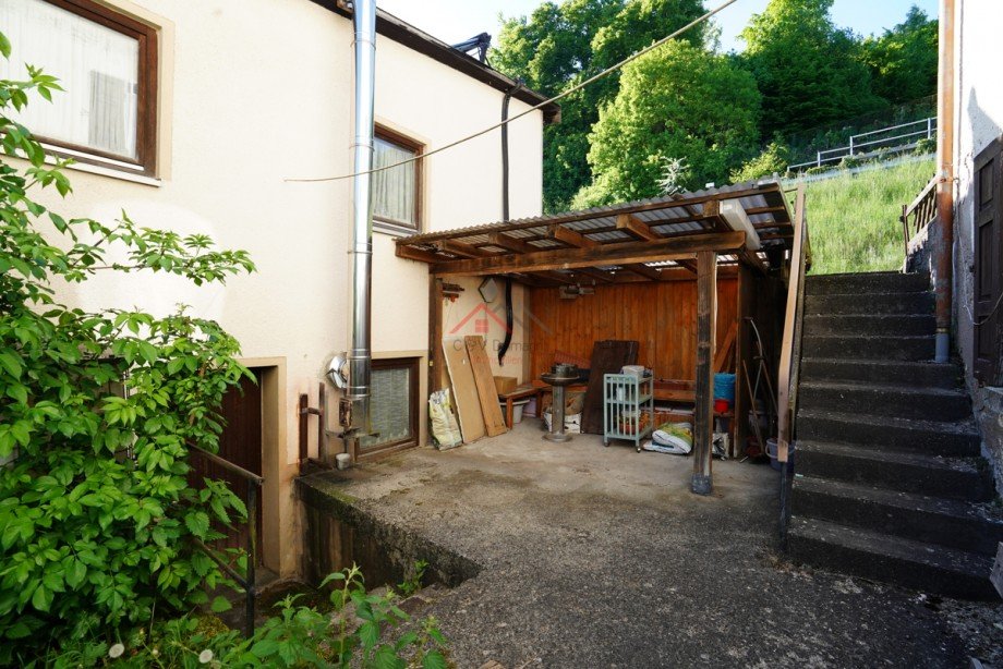 Terrasse zwischen Werkstatt und Haus Einfamilienhaus Irndorf